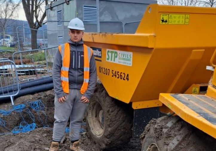STP apprentice on site with a dumper