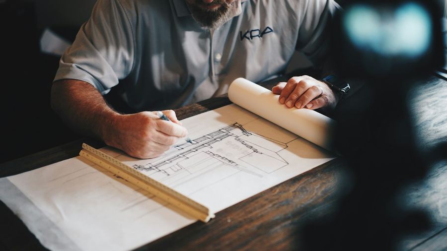 Architectural plans being drawn